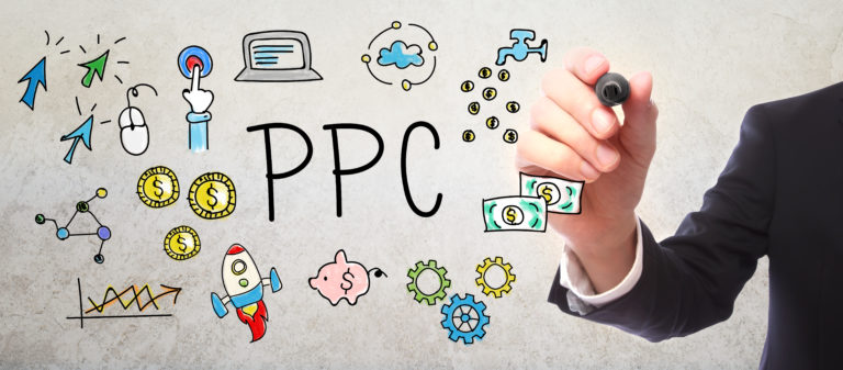 Businessman drawing PPC - Pay Per Click concept with a marker